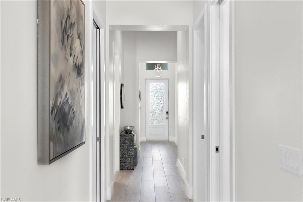 734 109th Avenue North Naples, FL 34108 - Photo 32 of 34 a view of a bathroom from a hallway