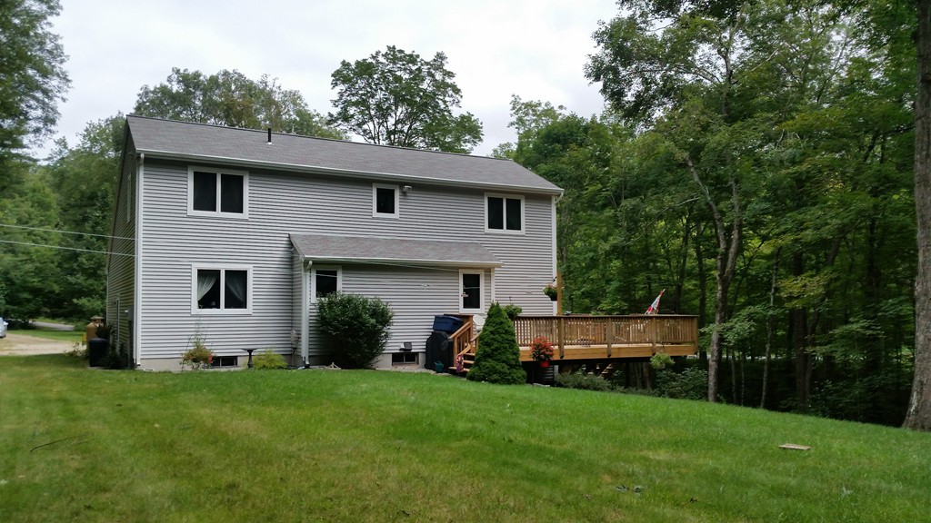 351 Quaddick Road Thompson, CT 06277 - Photo 12 of 28 a front view of a house with a yard