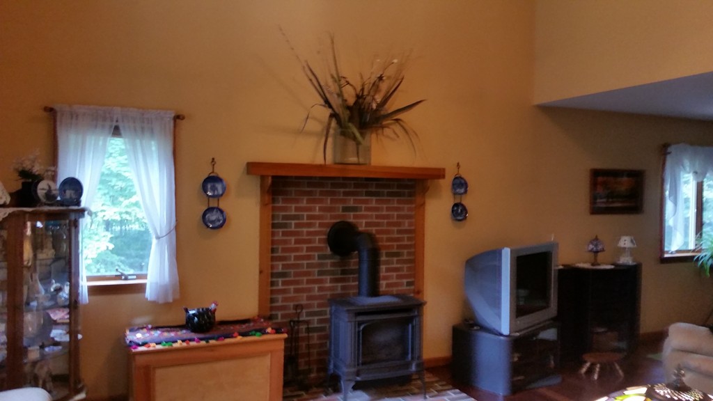 351 Quaddick Road Thompson, CT 06277 - Photo 14 of 28 a living room with furniture a flat screen tv and a fireplace
