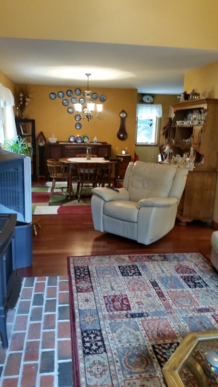 351 Quaddick Road Thompson, CT 06277 - Photo 16 of 28 a living room with furniture and a fireplace
