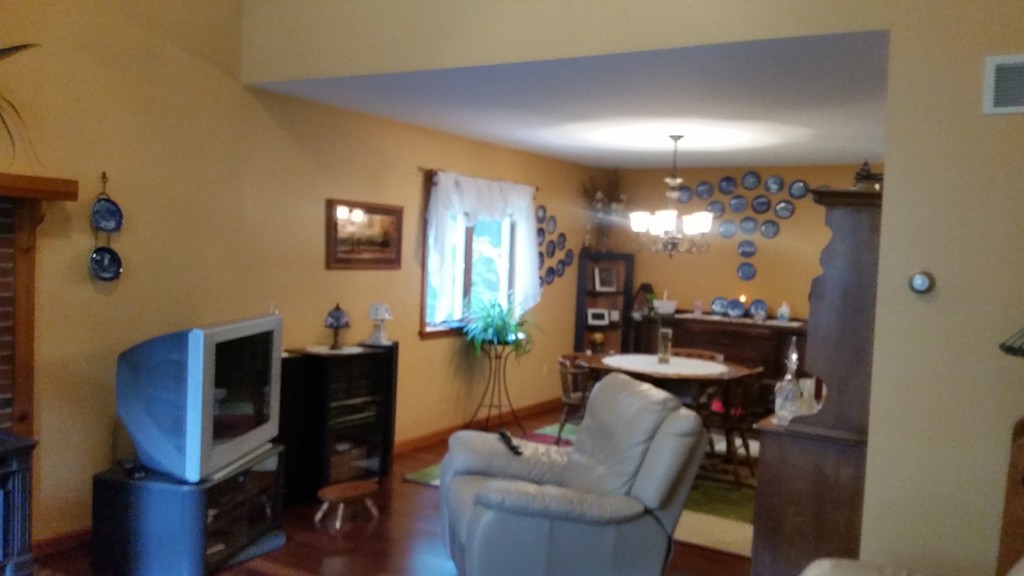 351 Quaddick Road Thompson, CT 06277 - Photo 20 of 28 a view of a livingroom with furniture and a bookshelf