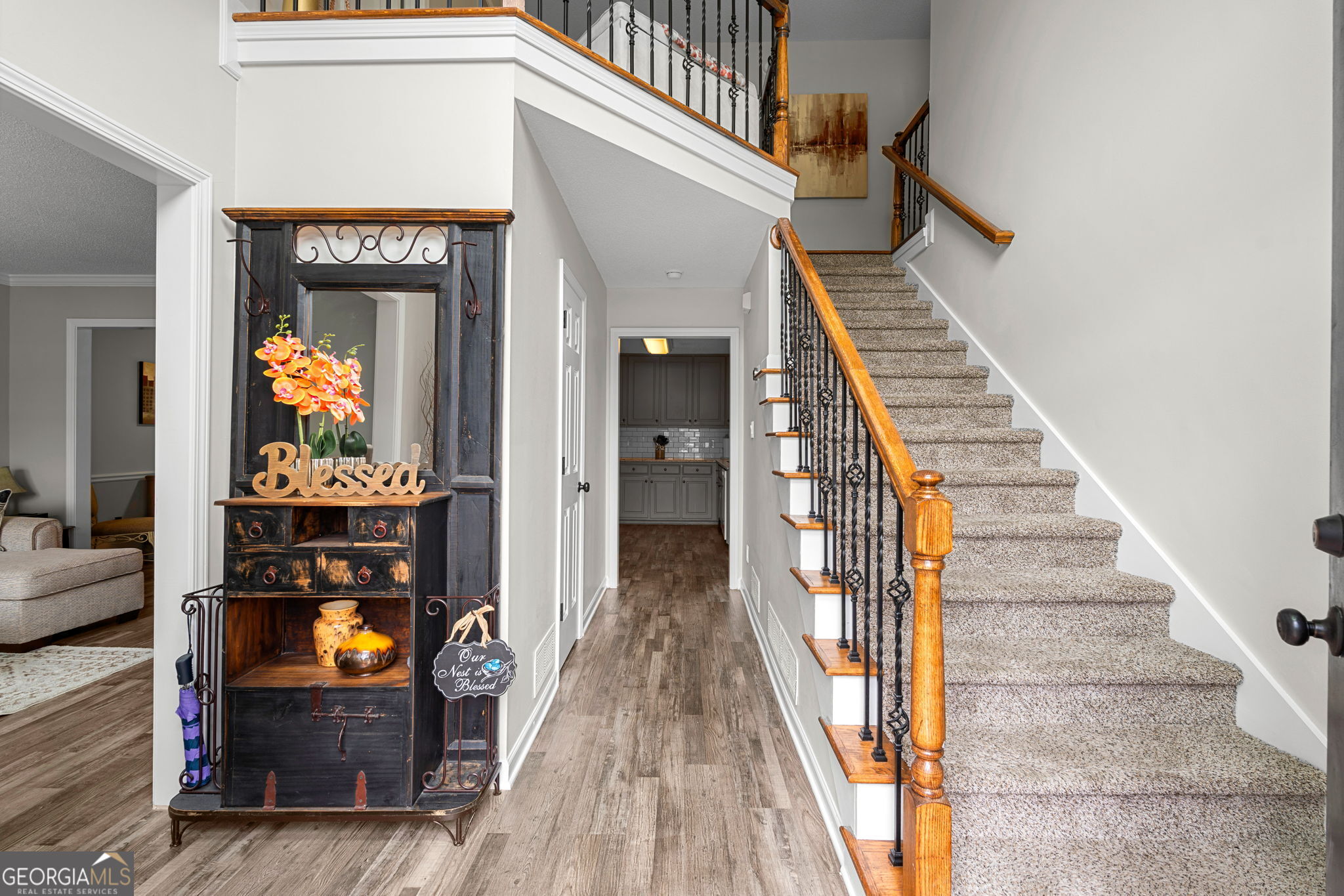 375 Gaelic Way Tyrone, GA 30290 - Photo 5 of 54 a view of a hallway with wooden floor and staircase