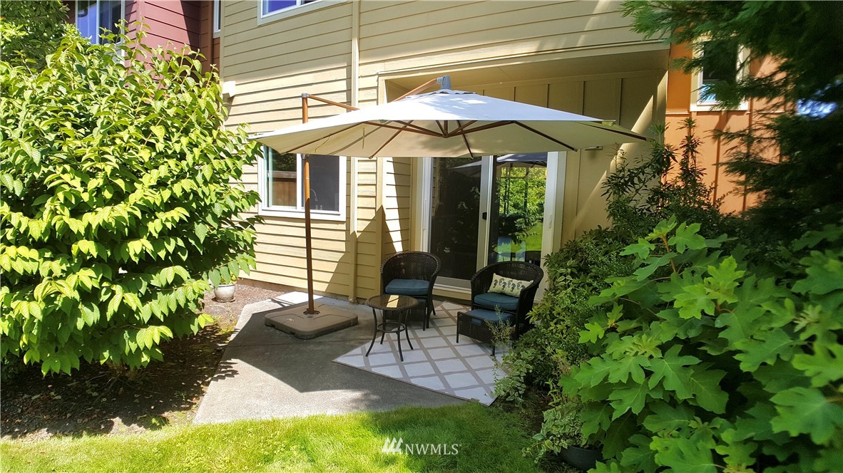 135 Cougar Ridge Road Northwest Issaquah, WA 98027 - Photo 22 of 22 a view of a house with patio