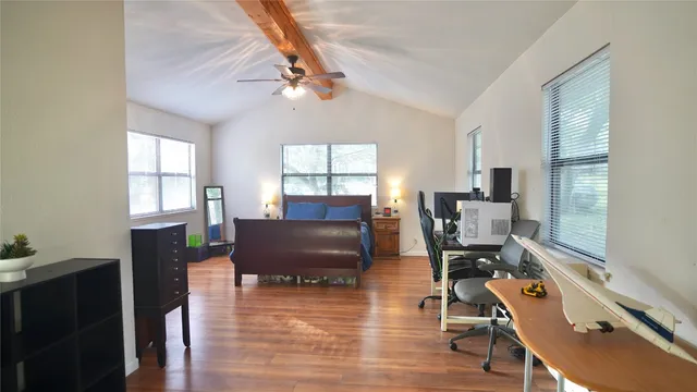 a living room with furniture window and wooden floor