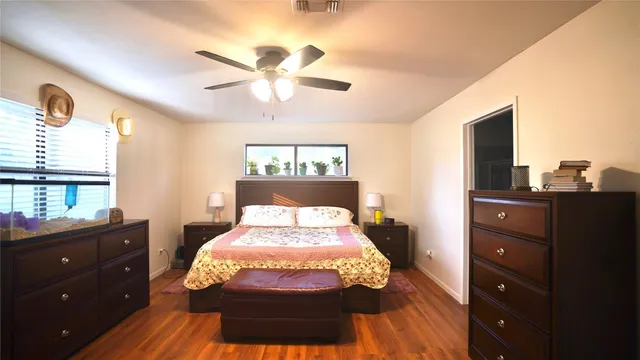 a bed room with a bed and a dresser