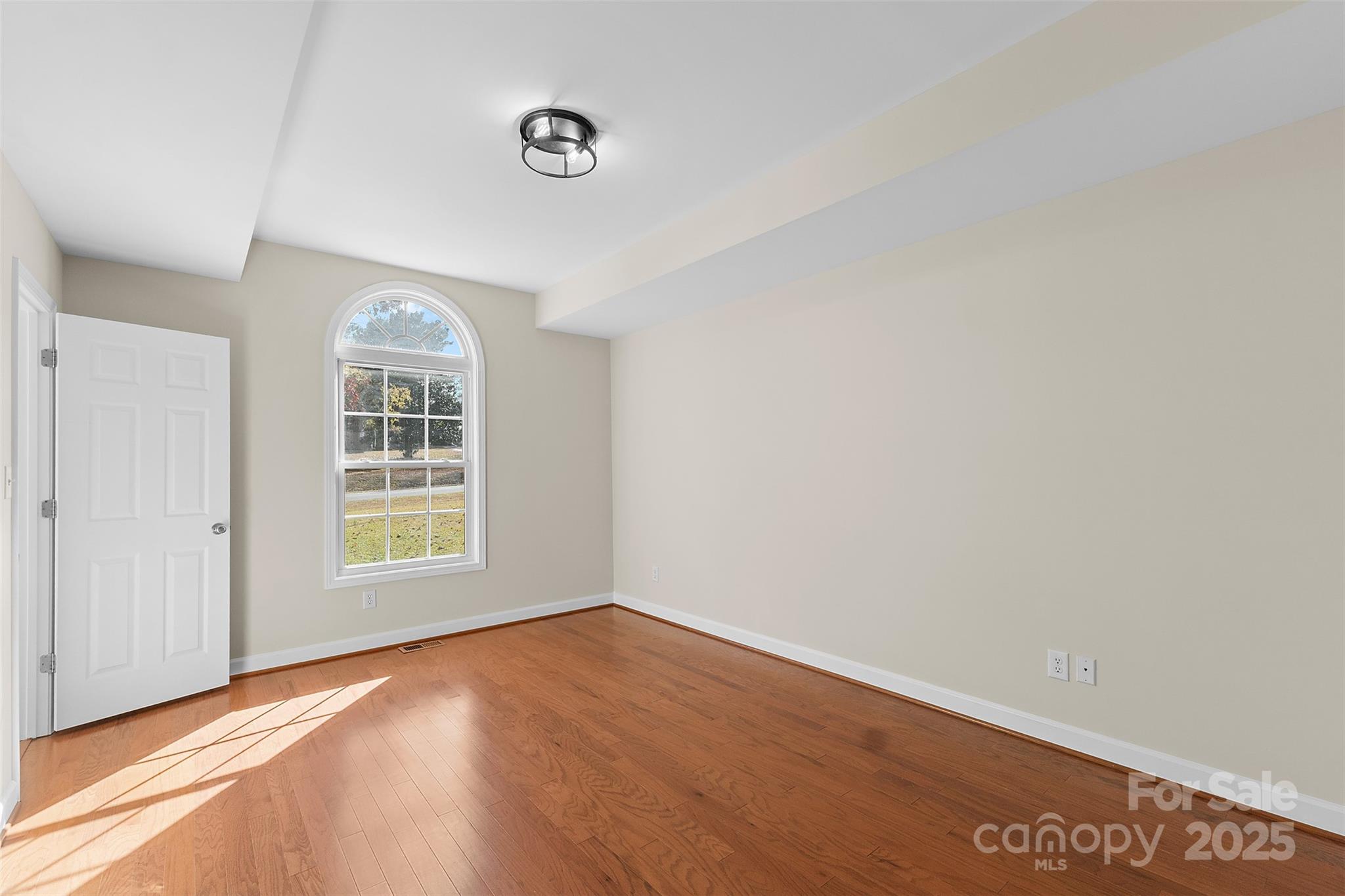 490 Rutledge Drive Catawba, SC 29704 - Photo 13 of 33 an empty room with wooden floor and windows