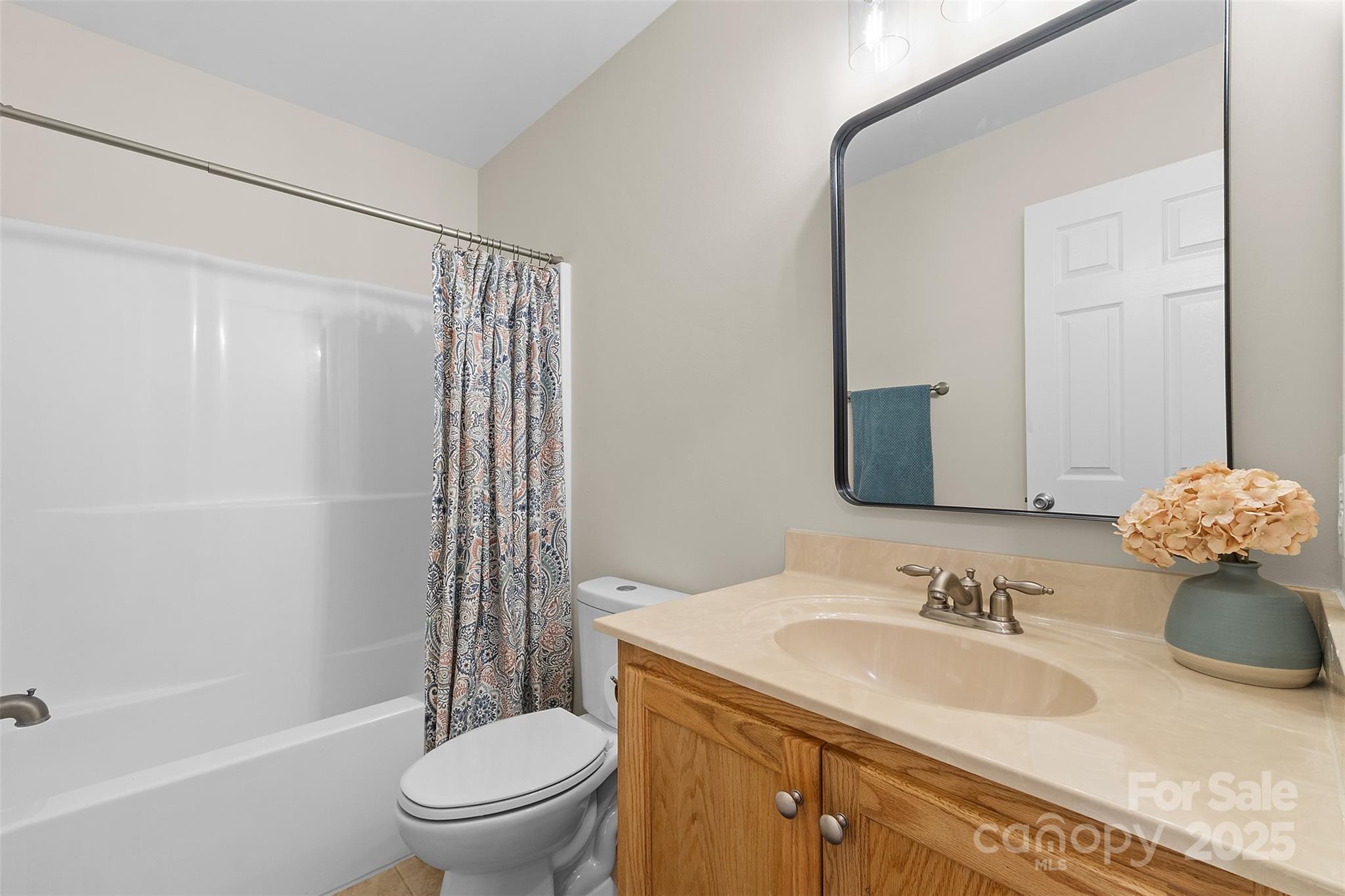 490 Rutledge Drive Catawba, SC 29704 - Photo 24 of 33 a bathroom with a granite countertop sink toilet a mirror and shower