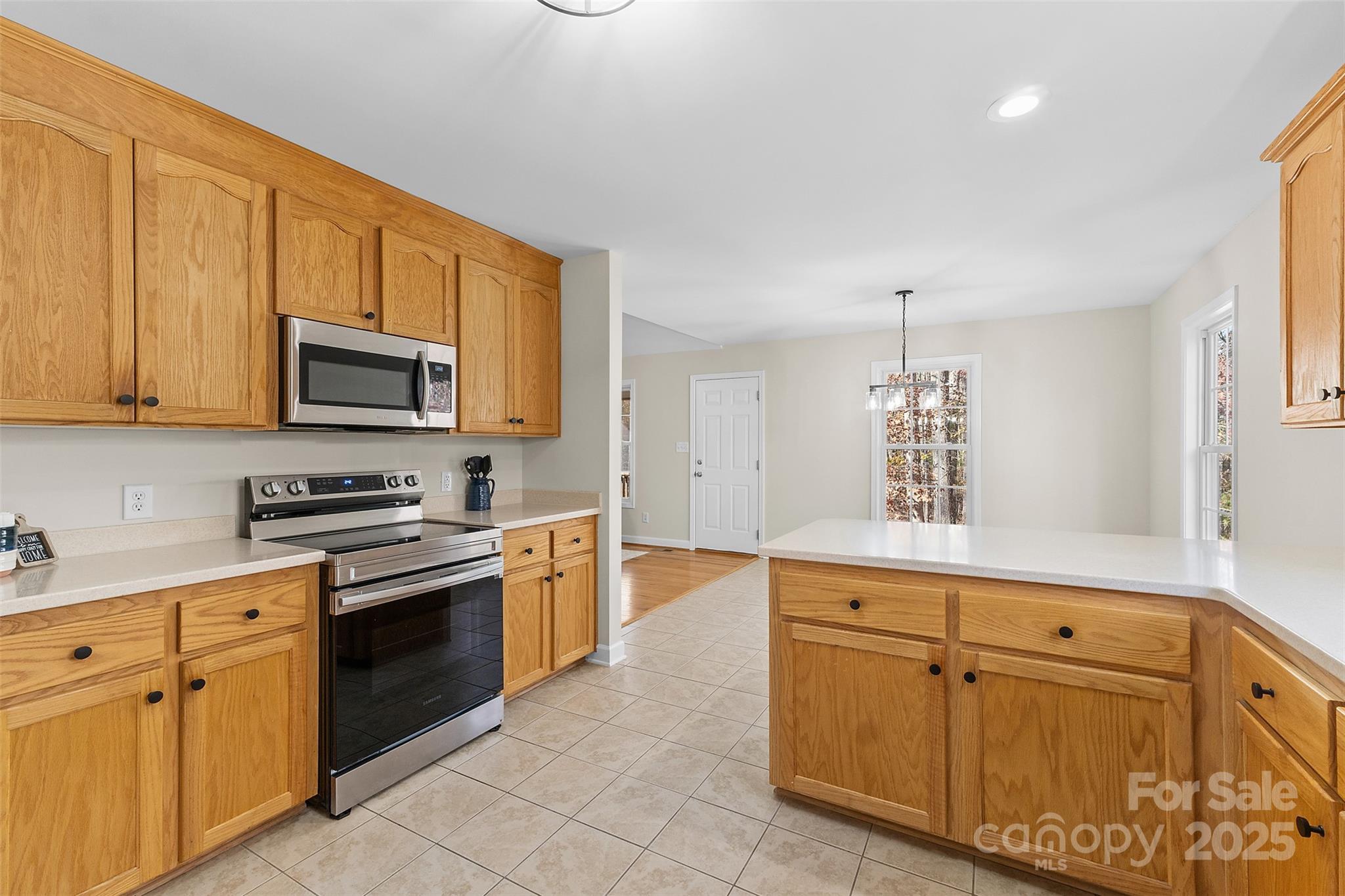 490 Rutledge Drive Catawba, SC 29704 - Photo 7 of 33 a kitchen with white cabinets sink and stainless steel appliances