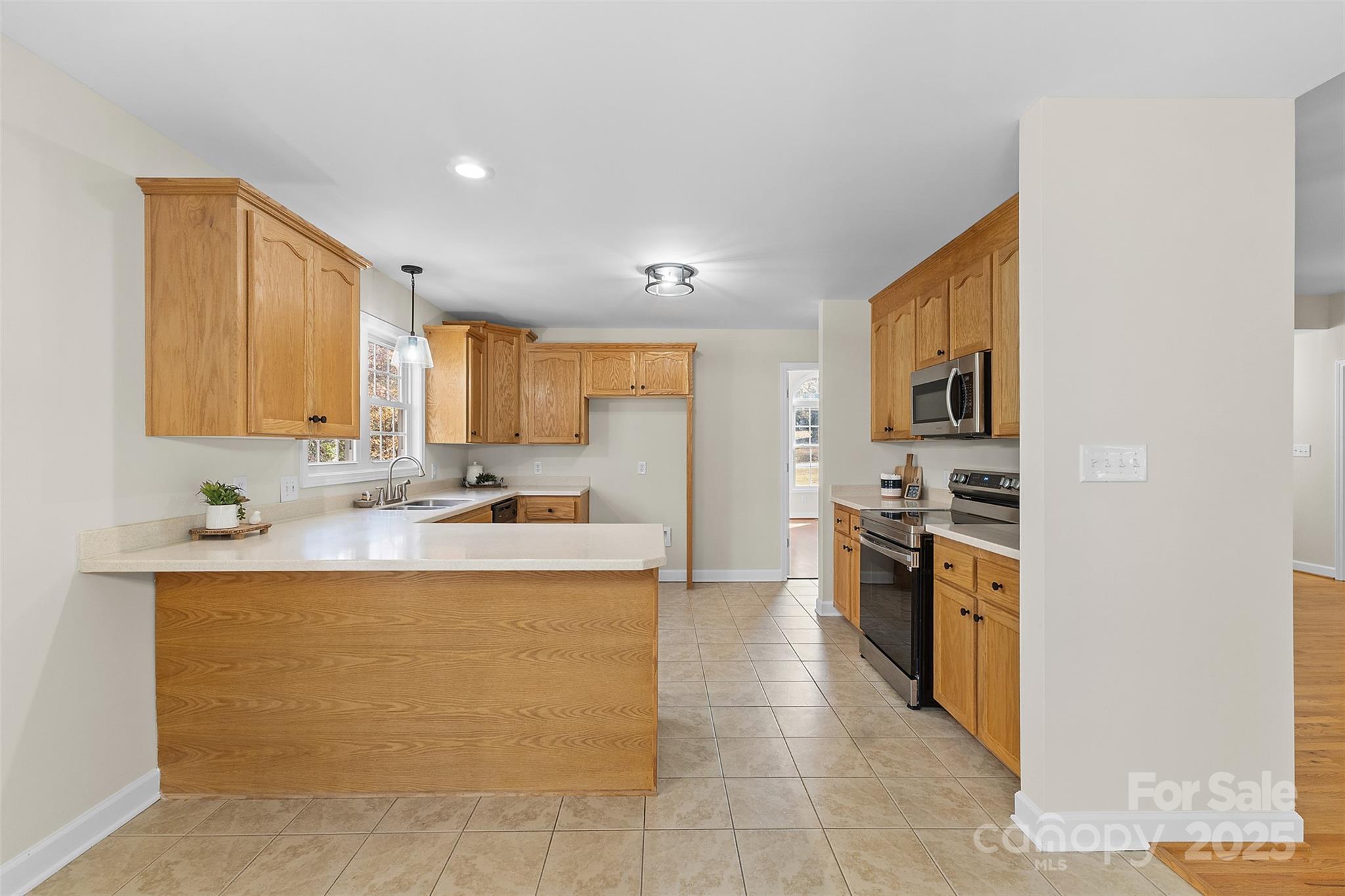 490 Rutledge Drive Catawba, SC 29704 - Photo 10 of 33 a large kitchen with stainless steel appliances a sink a stove and cabinets