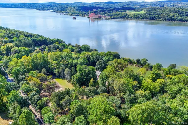 an aerial view of a houses with lake view