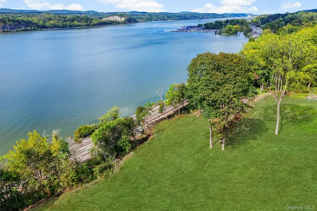 a view of a lake with houses in the back