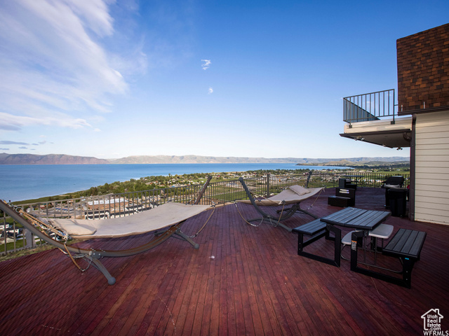 588 Raspberry Patch Road Garden City, UT 84028 - Photo 58 of 74 Wooden deck with a water and mountain view and outdoor dining space