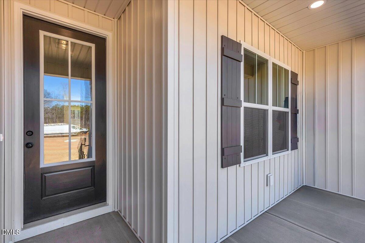 12615 Mallard Rock Drive Zebulon, NC 27597 - Photo 3 of 89 a view of a porch of a house