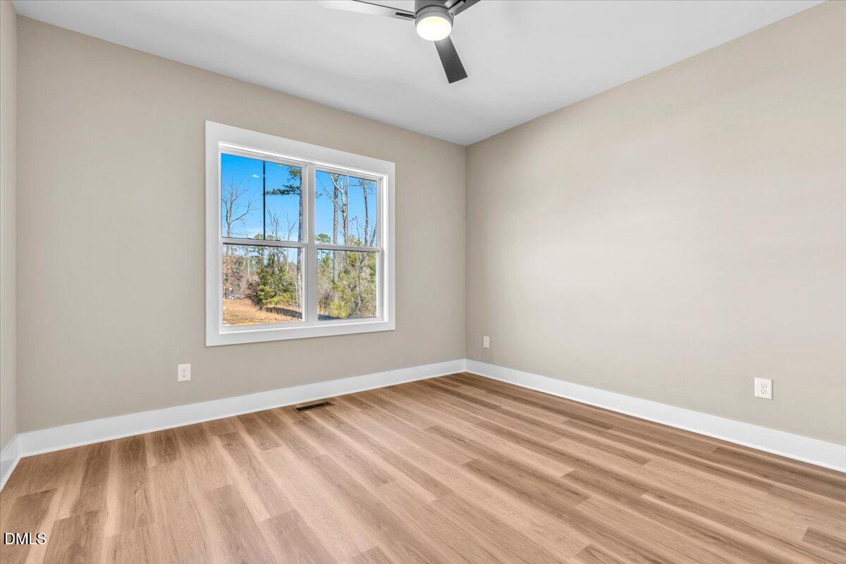 12615 Mallard Rock Drive Zebulon, NC 27597 - Photo 45 of 89 a view of an empty room with a window