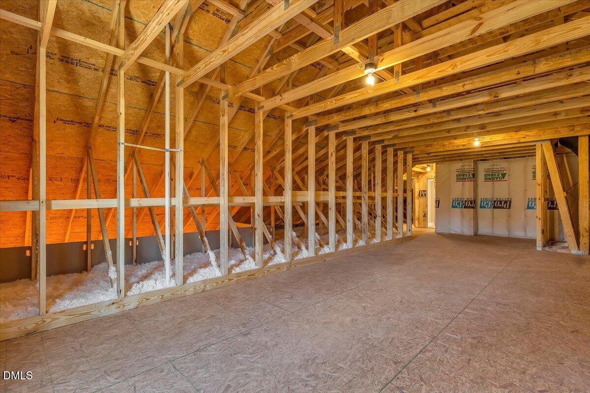 12615 Mallard Rock Drive Zebulon, NC 27597 - Photo 75 of 89 a view of an empty room with wooden floor and windows