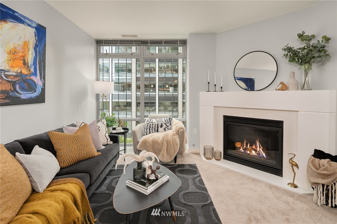 819 Virginia Street, Unit 1006 Seattle, WA 98101 - Photo 2 of 20 a living room with furniture a fireplace and window
