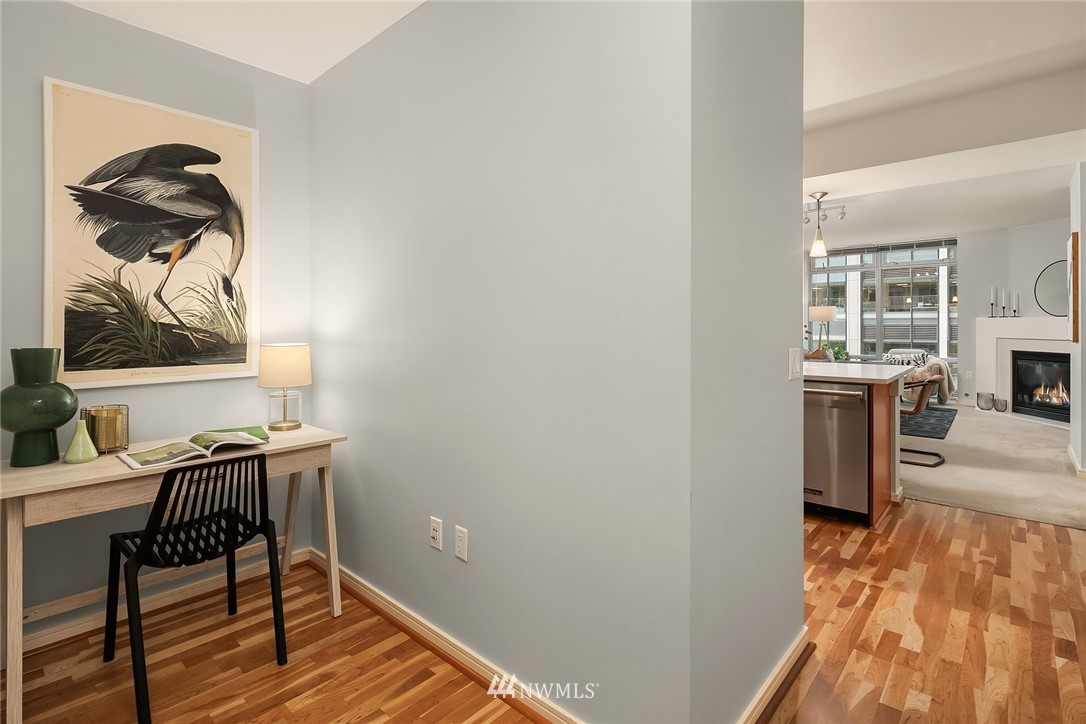 819 Virginia Street, Unit 1006 Seattle, WA 98101 - Photo 10 of 20 a view of a livingroom with furniture and wooden floor