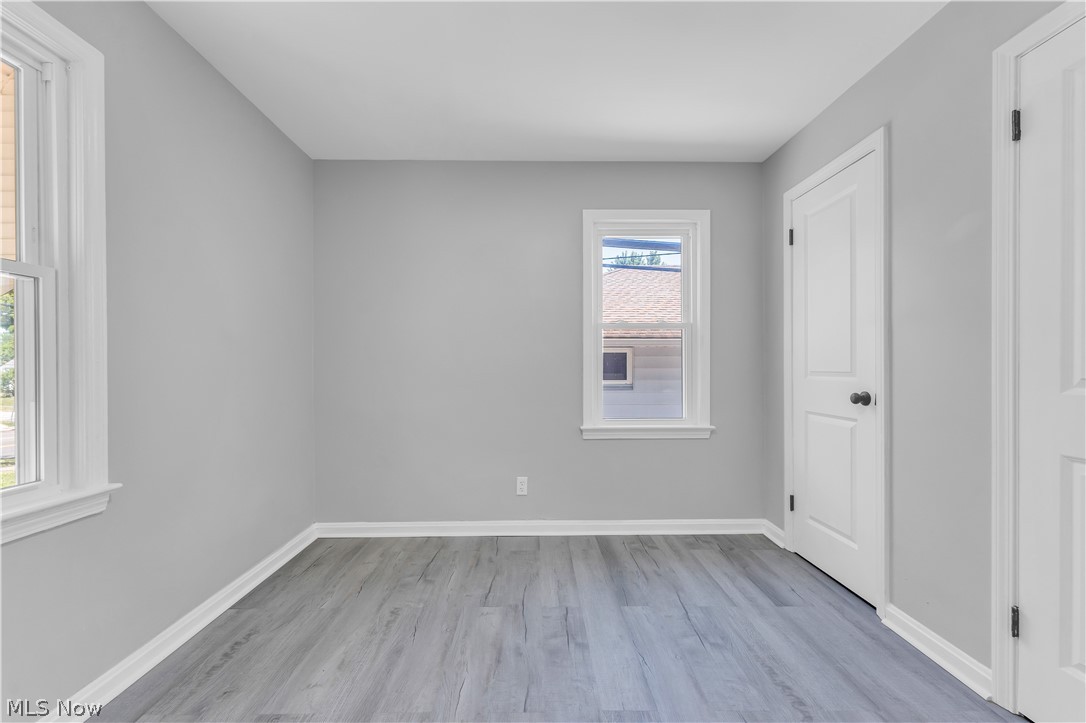 5581 Dunham Road Maple Heights, OH 44137 - Photo 17 of 33 Empty room with light hardwood / wood-style floors