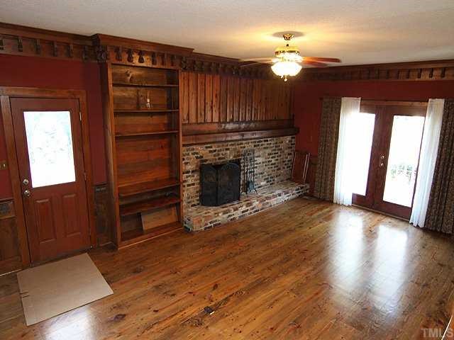 9108 Leesville Road Raleigh, NC 27613 - Photo 6 of 16 Heart Pine Flooring, Masonry Gas Log Fireplace, Heavy Trim Moldings