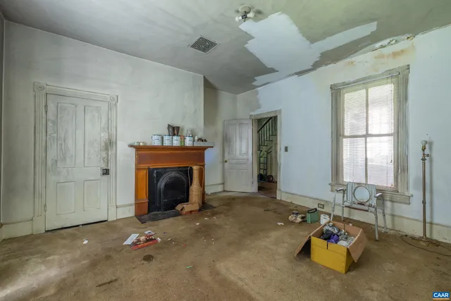 a room with furniture and a fireplace