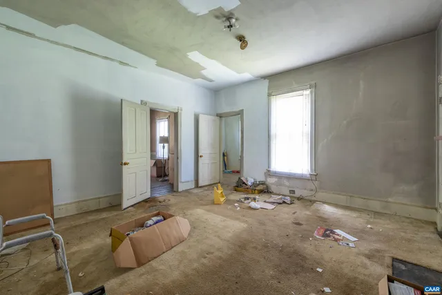 a bed room with a bed and a window