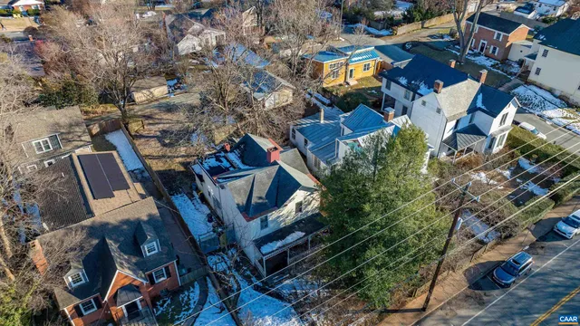 an aerial view of a house with outdoor space