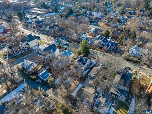 an aerial view of a residential houses with outdoor space