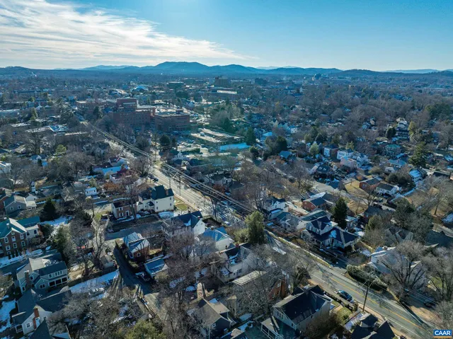 an aerial view of residential houses and city view