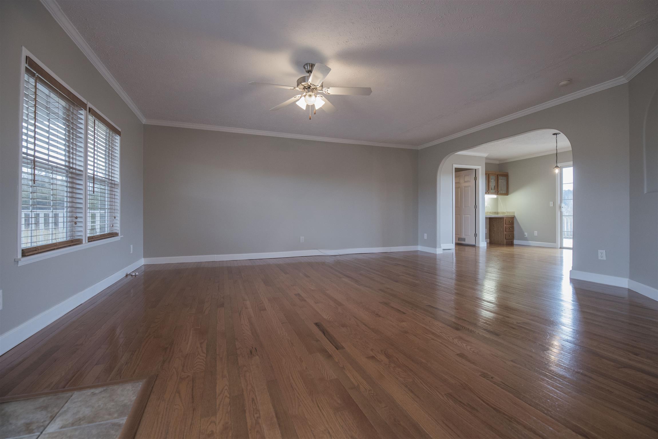 1227 Linwood Road Watertown, TN 37184 - Photo 17 of 29 a view of an empty room with wooden floor and a window