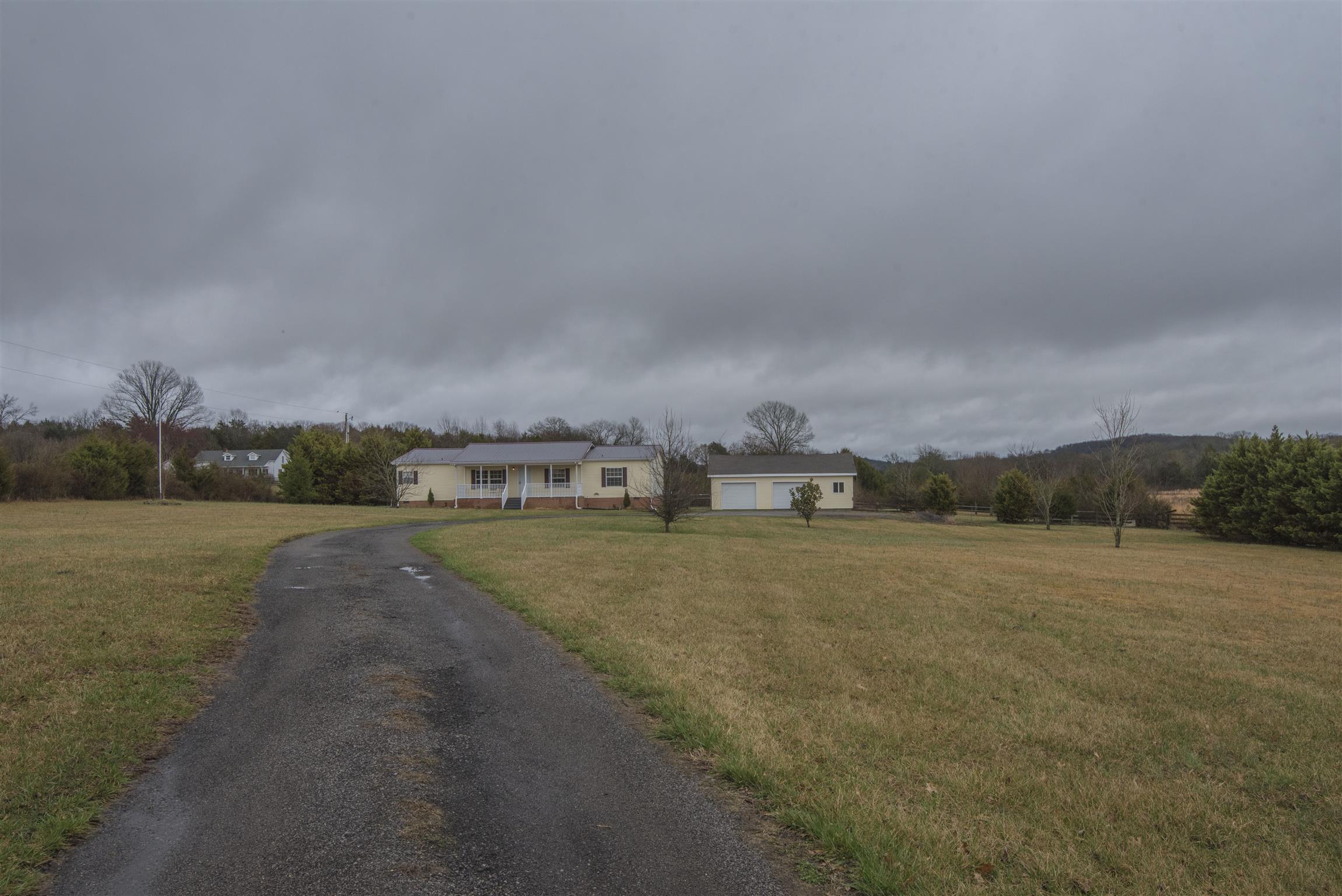 1227 Linwood Road Watertown, TN 37184 - Photo 4 of 29 a view of a big yard with a houses