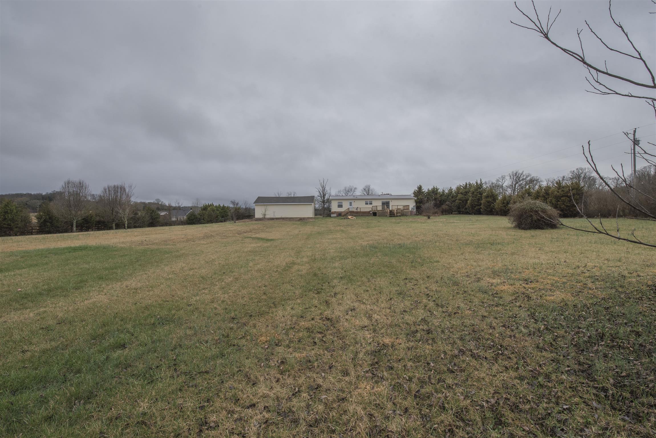 1227 Linwood Road Watertown, TN 37184 - Photo 7 of 29 a view of a field with trees in background
