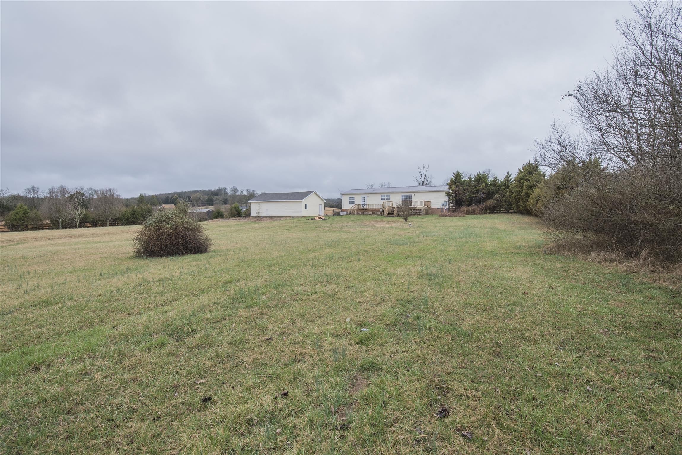 1227 Linwood Road Watertown, TN 37184 - Photo 8 of 29 a view of a field with trees in background