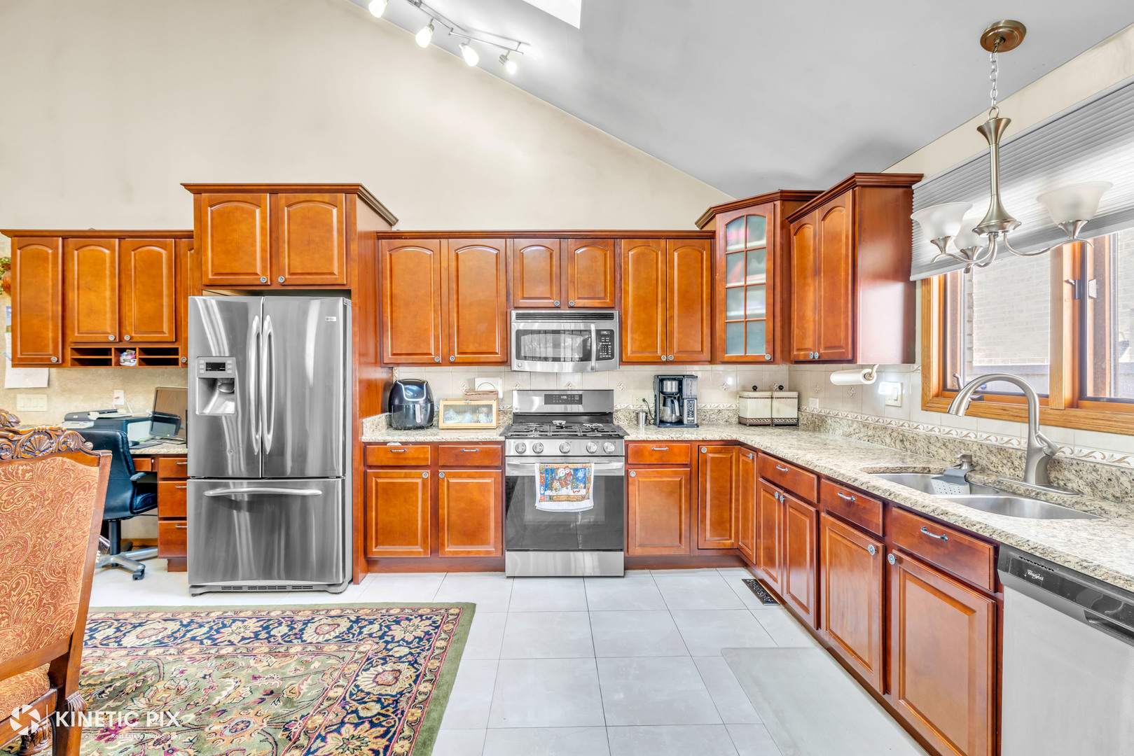 8619 Linder Avenue Burbank, IL 60459 - Photo 11 of 40 a large kitchen with stainless steel appliances granite countertop a refrigerator and a sink