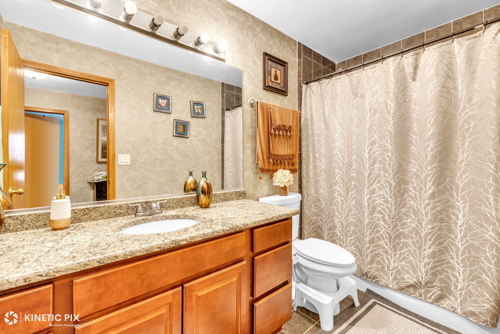 8619 Linder Avenue Burbank, IL 60459 - Photo 18 of 40 a bathroom with a granite countertop sink toilet and shower