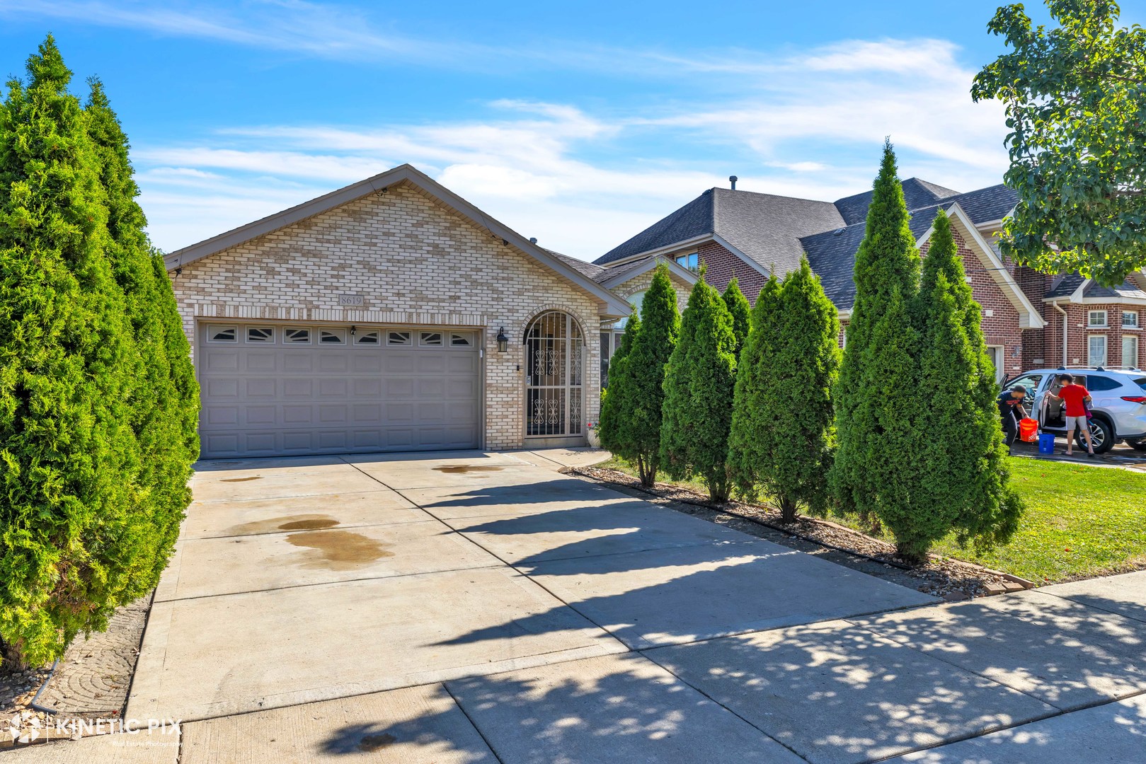 8619 Linder Avenue Burbank, IL 60459 - Photo 2 of 40 a front view of a house with a yard and potted plants