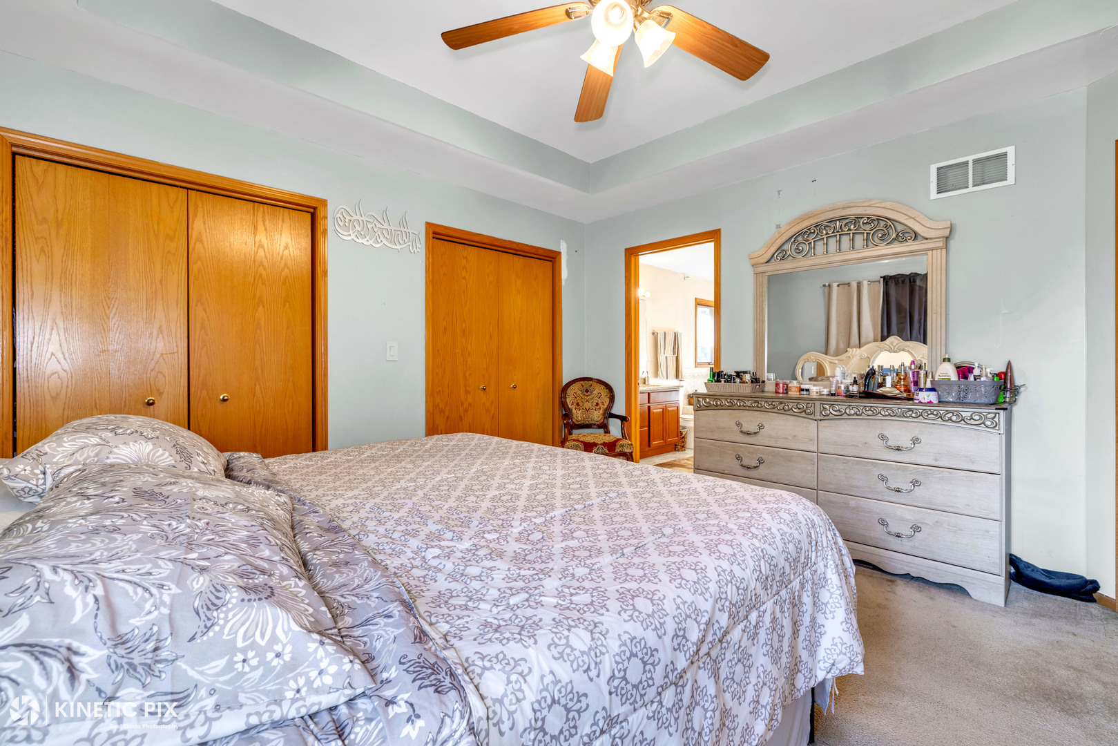 8619 Linder Avenue Burbank, IL 60459 - Photo 21 of 40 a bedroom with a bed and a chandelier