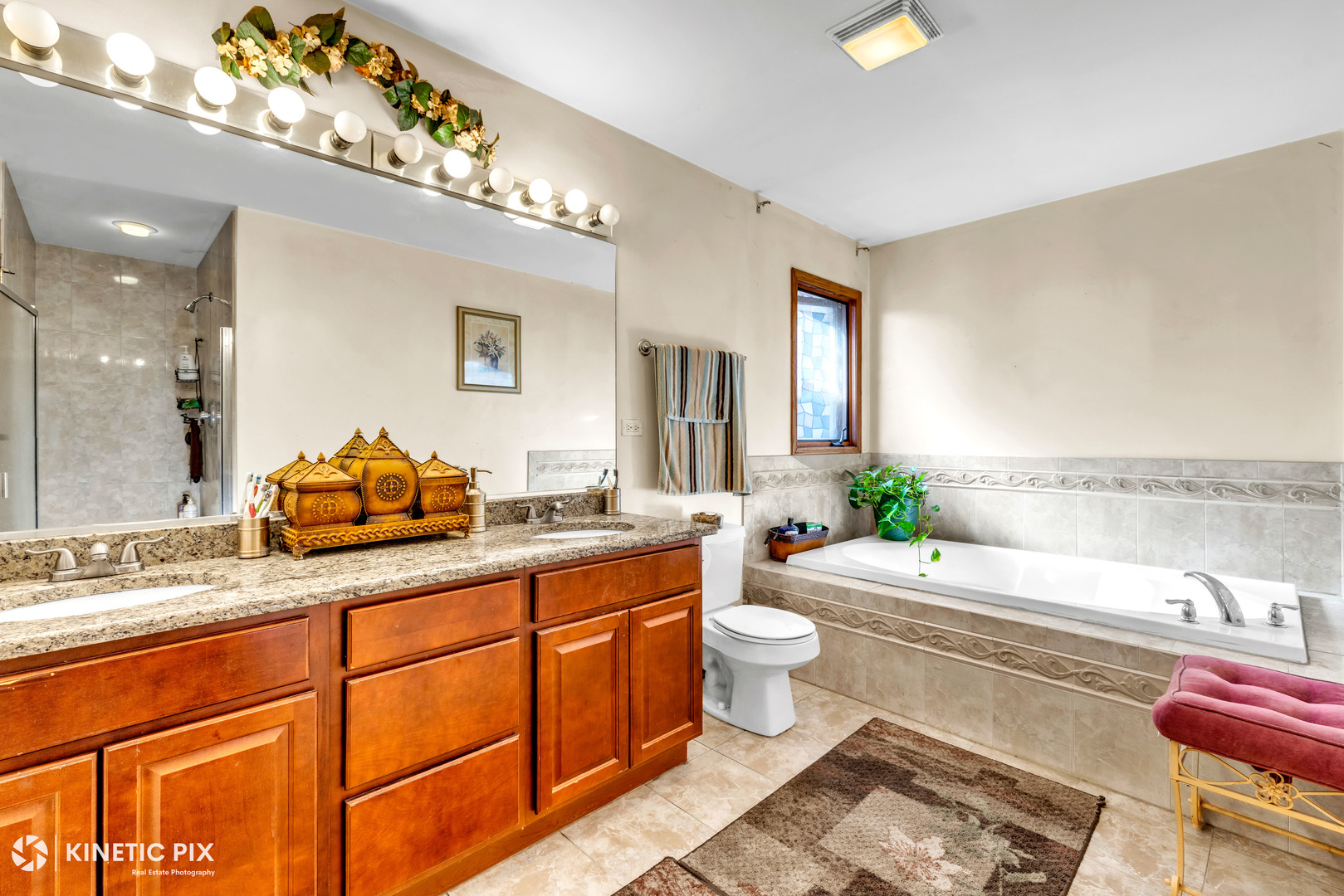 8619 Linder Avenue Burbank, IL 60459 - Photo 22 of 40 a bathroom with a granite countertop sink mirror vanity and toilet