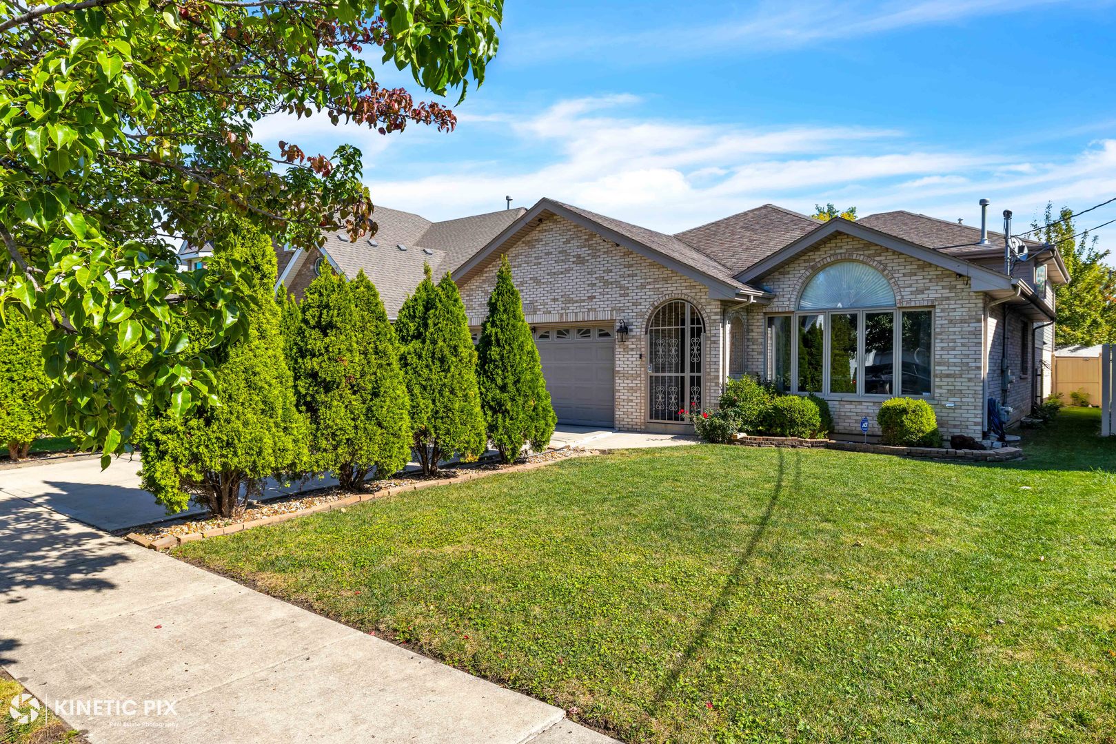 8619 Linder Avenue Burbank, IL 60459 - Photo 3 of 40 a front view of a house with a yard and porch