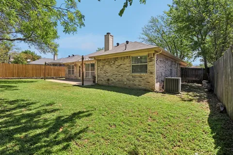 a view of a large trees in front of a house
