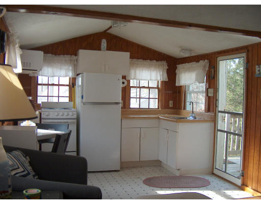 4 A Thompson Road Bourne, MA 02532 - Photo 5 of 9 a kitchen with stainless steel appliances granite countertop a refrigerator and a stove top oven