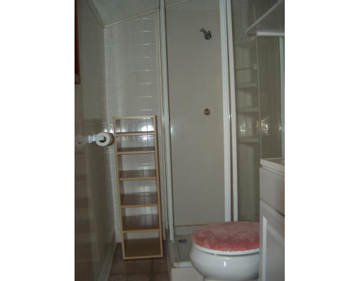4 A Thompson Road Bourne, MA 02532 - Photo 6 of 9 a bathroom with a toilet and a shower