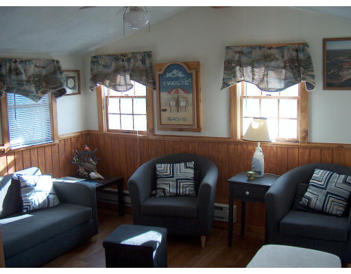 4 A Thompson Road Bourne, MA 02532 - Photo 7 of 9 a living room with furniture and a large window