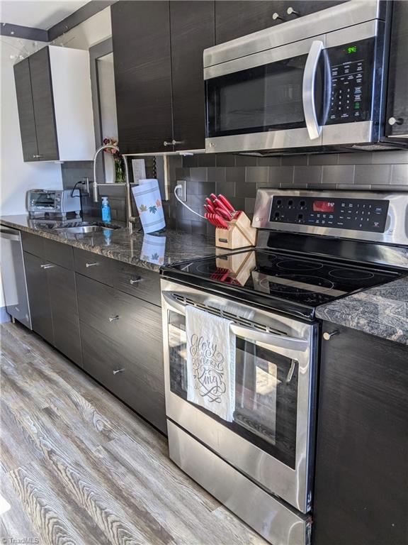 134 Fraley Fields Road High Point, NC 27262 - Photo 6 of 21 Renovated kitchen with beautiful granite countertops.