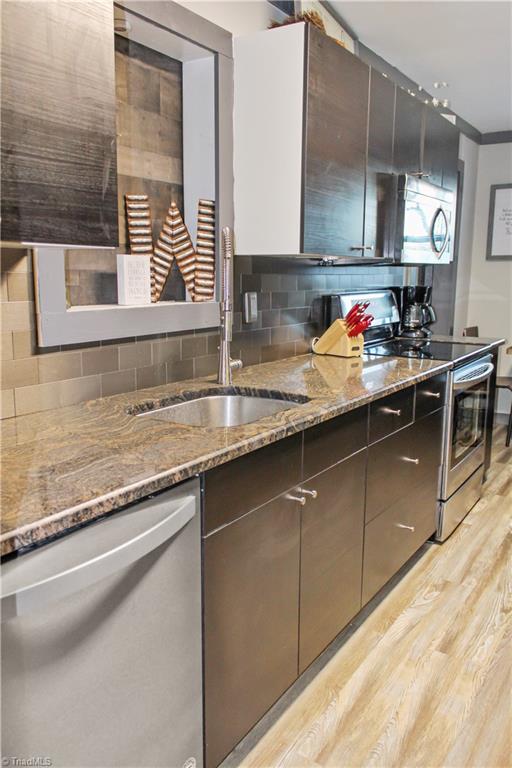 134 Fraley Fields Road High Point, NC 27262 - Photo 10 of 21 Remodeled kitchen with new dishwasher and refrigerator.