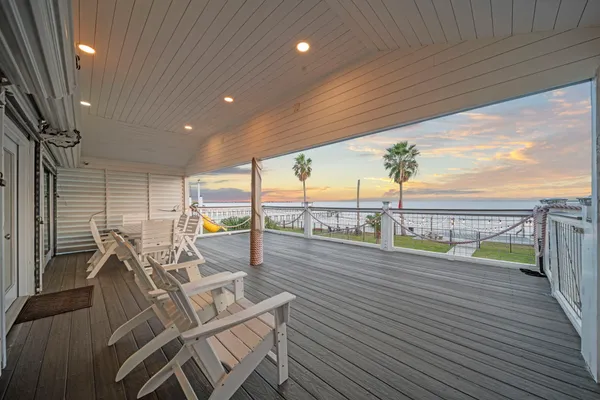 a view of a balcony with furniture