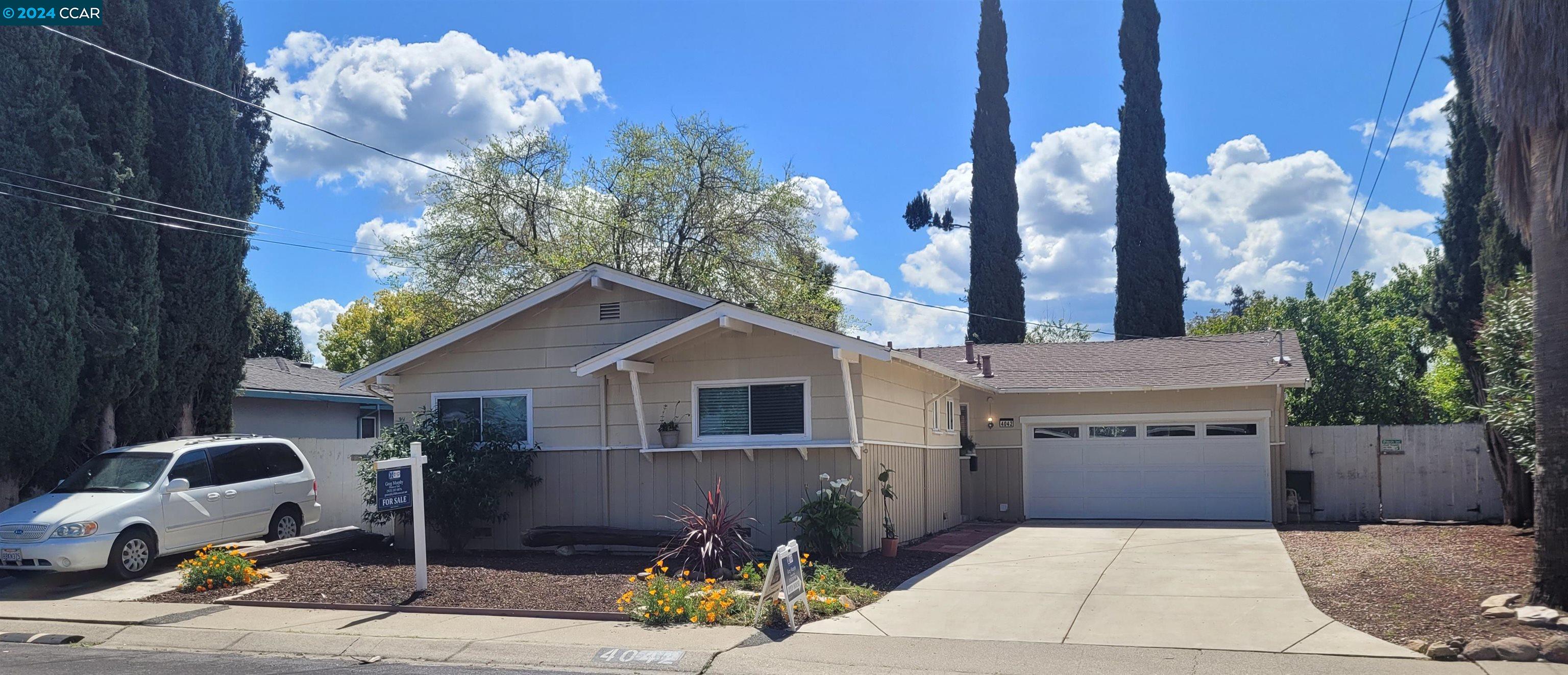 a front view of a house with yard