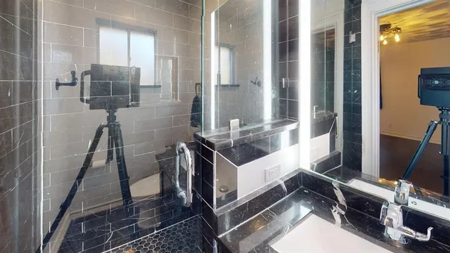 a kitchen with a sink appliances and cabinets