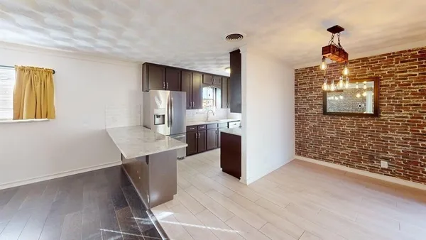 a view of a kitchen cabinets and wooden floor