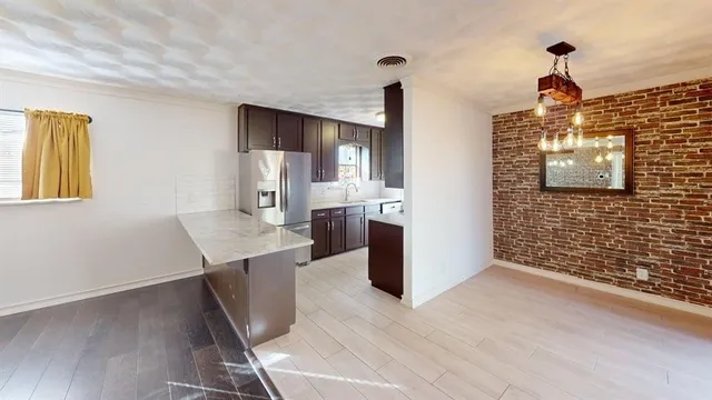 a view of a kitchen cabinets and wooden floor