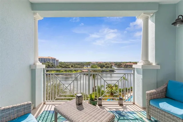 a view of a balcony with chair and wooden floor